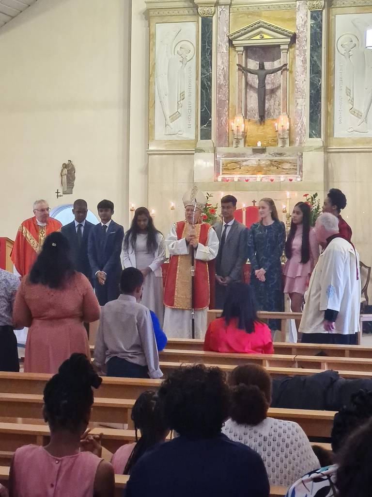 Bishop Paul Hendricks and newly confirmed at St. Simon Stock Catholic Church Ashford at the Confirmation Mass