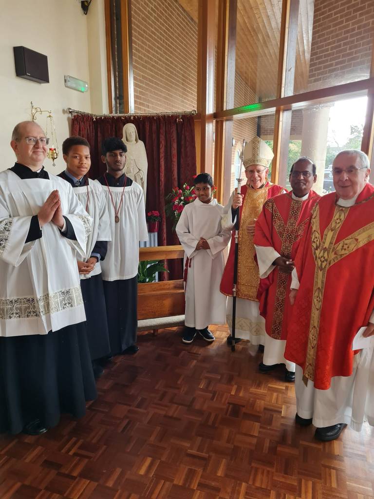 Bishop Paul Hendricks, Fr. Hans, Fr. Joe, and servers at St. Simon Stock Catholic Church Ashford for the Confirmation Mass